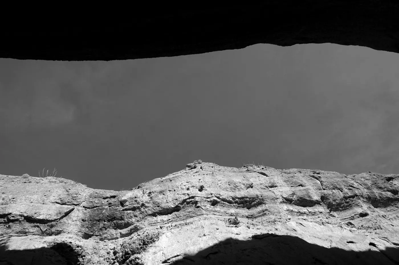 A rocky ridge beneath a dark sky in Big Bend National Park